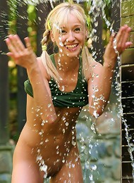 Cute teen gets soaking wet and rubs